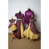 Coordinated family outfit set in plum and gold featuring embroidered dresses for mom and daughters, and a satin shirt for dad.