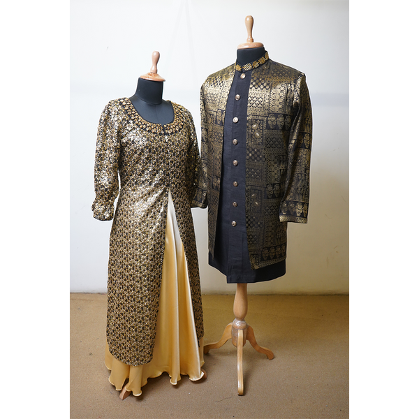 Black and gold embroidered jacket gown and sherwani couple outfit on mannequins