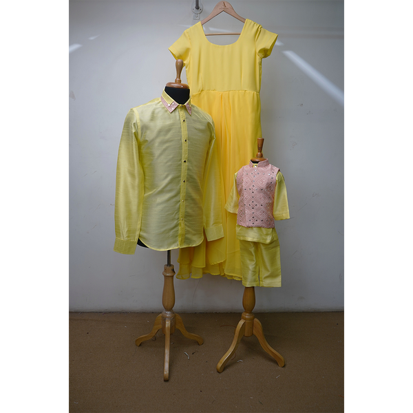 Family Matching Yellow Ethnic Outfit Set – Mom Gown, Dad Shirt & Baby Boy Kurta–Vest Dhoti Combo