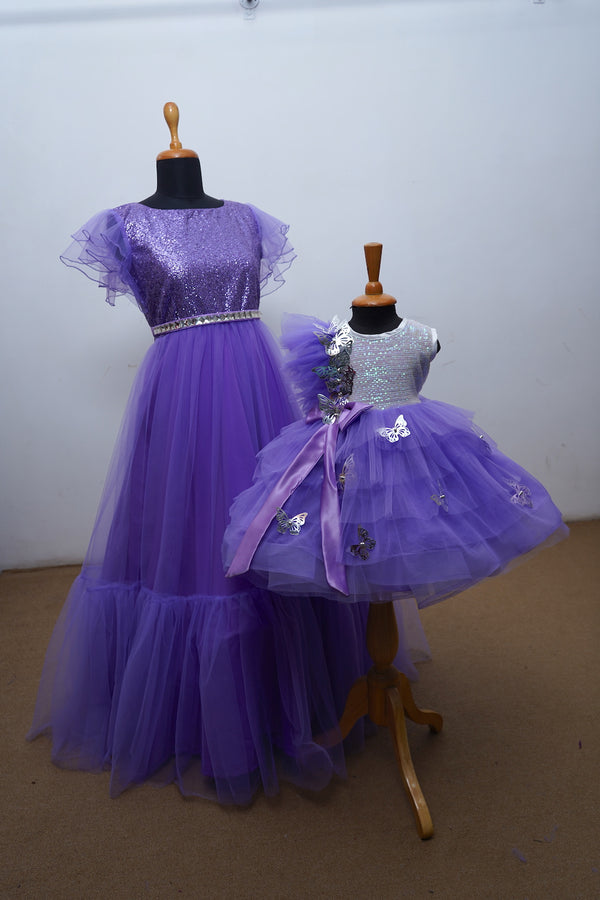 Lavender Baby Gown With Frills ,Foil Butterflies And Pleated Gown With Sequence , Net Mom Daughter Combo