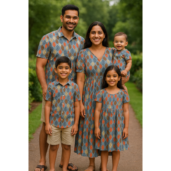 Indian family wearing rust & grey geometric leaf print matching outfits – cotton coordinated wear for mom, dad, son, daughter, and baby.

