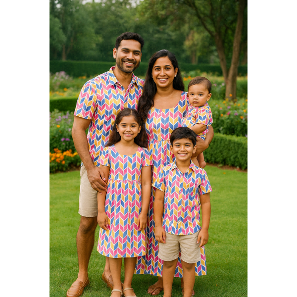 Indian family in vibrant multicolor geometric cotton matching outfits – mom, dad, son, daughter, and baby in coordinated summer wear

