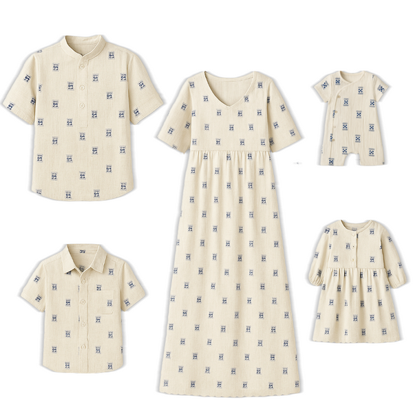 Off-white handloom-inspired cotton family combo dress with navy blue motifs – includes dresses, shirts, and baby romper