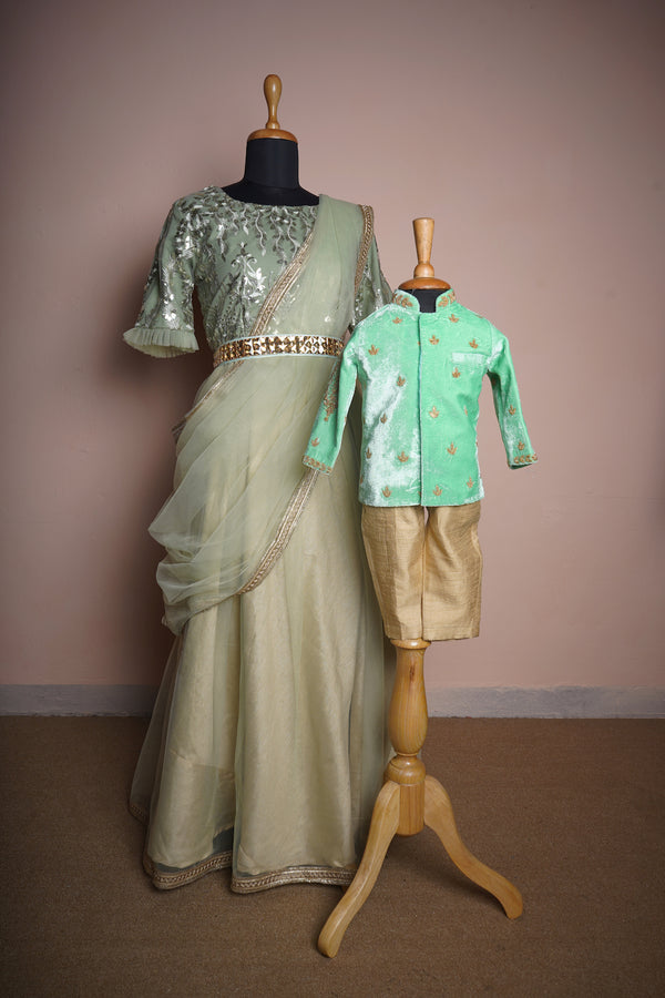Light Green Fancy Embroidery Net and Plain Net with Special Embroidery work and Gold Stone Belt Mom and Son Combo