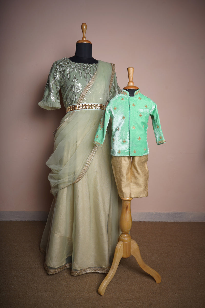 Light Green Fancy Embroidery Net and Plain Net with Special Embroidery work and Gold Stone Belt Mom and Son Combo