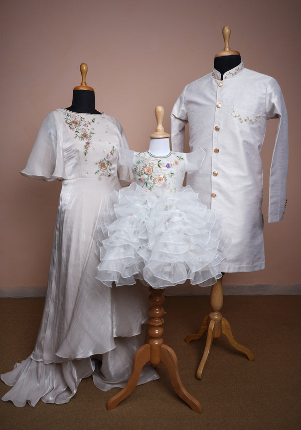 White Rawsilk and Chinon and Glitter Organza with Special Embroidery work in Family Clothing