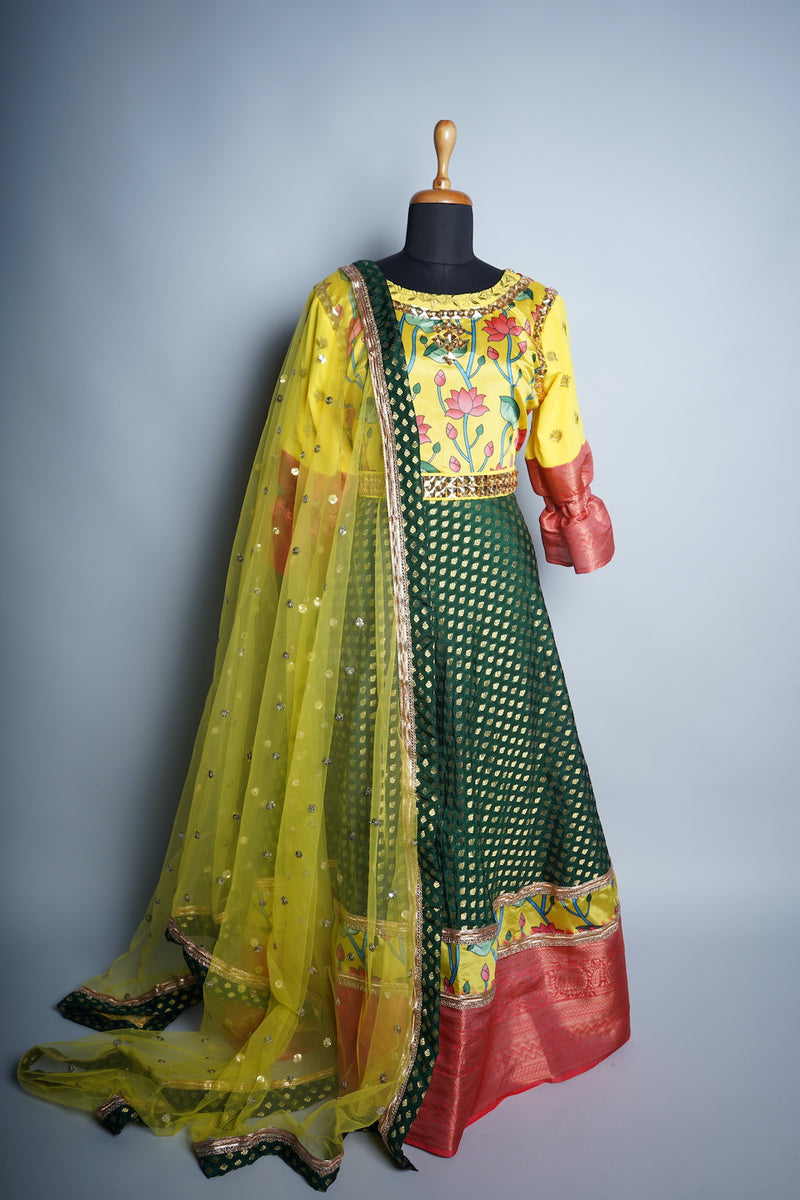 Yellow Kalamkari and Green Brocade with Red Border Speacial Embroidery wrok in Womens Reception Dress