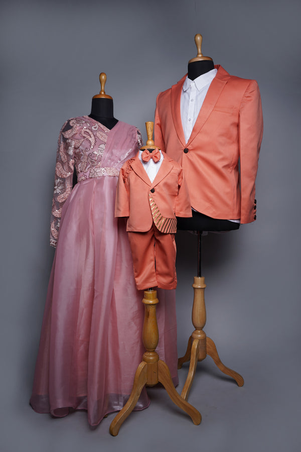 Peach Fancy Embroidery net and Organza with Orange Suiting Fabric and Special Metal Stripes works in Family Clothing