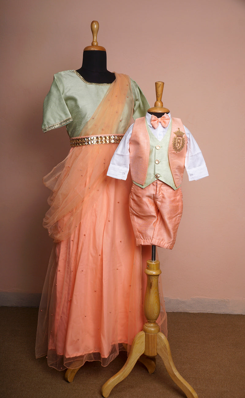 Light Orange and Light Green Rawsilk and Pearl net with Special Embroidery work and Gold Stone Belt Mom and Son Combo